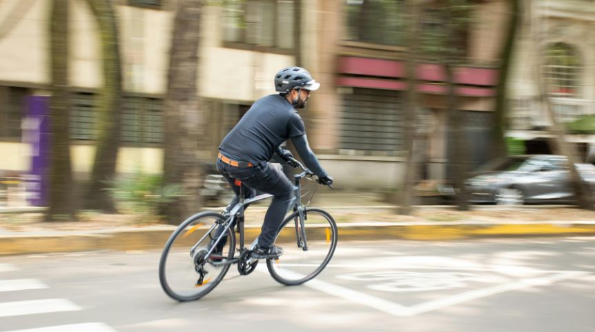 Man riding a bike in a bikelane