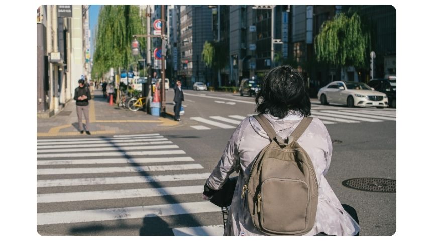 Person waiting at a cross walk